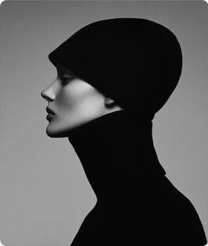 Profile portrait in a black beanie