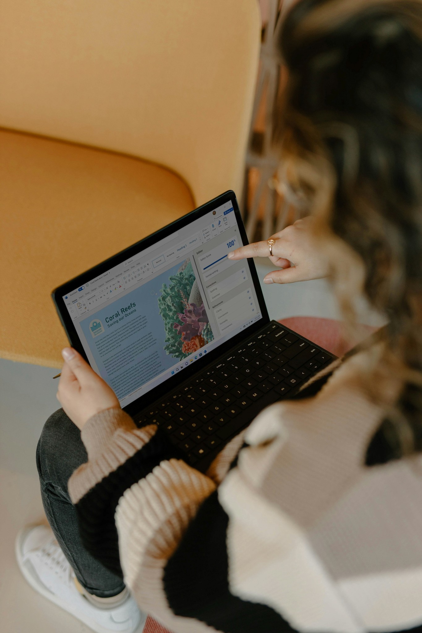 Person using a laptop in bed